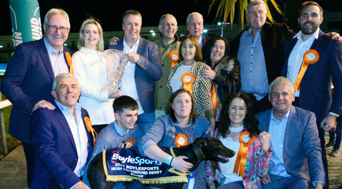 Jenna Boyle Presents the trophy to John Mitchell and the Whatever-you Like-Syndicate after Born Warrior won the 2022 BoyleSports Irish Greyhound Derby at Shelbourne Park , Also inc are Jennifer O Donnell (Trainer), Matthew and Frances   O'Donnell, Dolores Ruth, Frank Nyhan Chairman GRI and Peter Burke Minister for Local Goverment and Planning. Photo from GRIreland.ie via Canva.com.