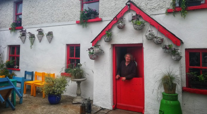 Jim Ryan standing in the doorway of his house and pub, Jim o' the Mill's, Upperchurch, Tipperary | Photo (c) Tipp FM/MaryAnn Vaughan