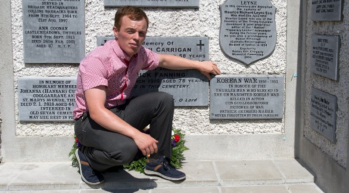 Tommy Barrett, grand-nephew of Con Goldsborough, posing with the new plaque in St Mary's Garden of Remembrance | Photo: Tommy Barrett
