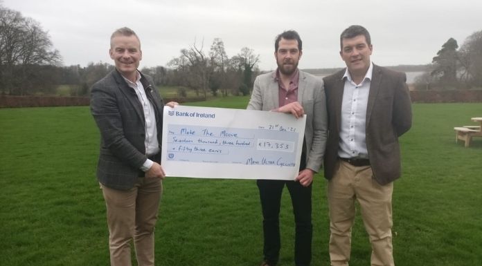 Alan Heaney (left) and Niall McGauran (right) of the Mayo Ultra Cyclists presenting a cheque to Macra na Feirme National President and Make the Moove cofounder John Keane (centre).