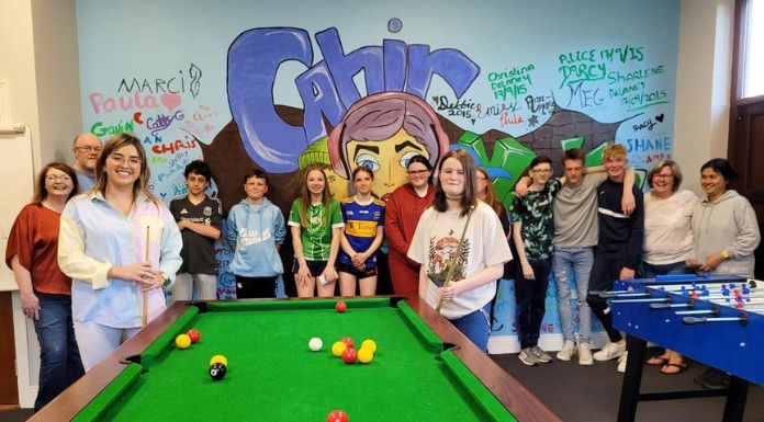 Máirín pictured with some members and volunteers of the Teen Cave Youth Club in Cahir Town
