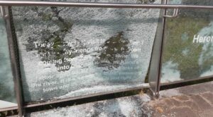 One of the glass panels on Old Bridge, Clonmel, damaged by vandals. Photo © Tipp FM. 