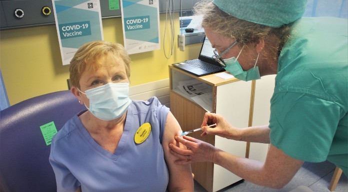 Nurse Rosaline O'Brien receiving the first Pfizer COVID-19 vaccine at UHL from Dr  Catherine Motherway