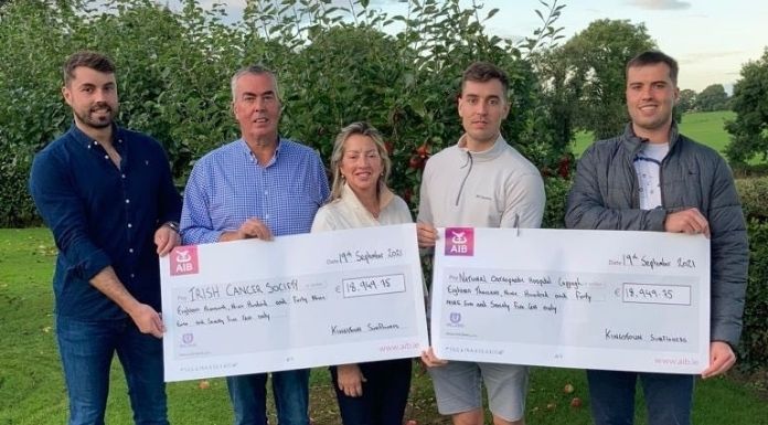 Eoin, Sean, Moira, Bryan and Niall Laffan with their two donations for the Irish Cancer Society and the National Orthopaedic Hospital, Cappagh from the sunflower farm in Cashel. Photo courtesy of the Laffan family.